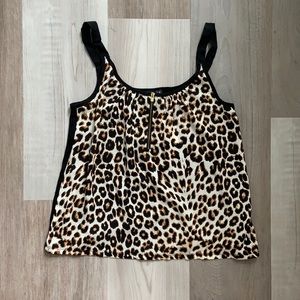 Cheetah print tank top w/gold zipper in front.